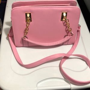 Pink crossbody and hand bag.